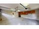 Functional garage with storage cabinets and door leading to the backyard at 1477 Triple Creek Nw Ct, Kennesaw, GA 30144
