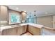 Bright kitchen features stainless steel appliances, white countertops, and tile backsplash at 1477 Triple Creek Nw Ct, Kennesaw, GA 30144