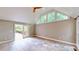 Bright living room with vaulted ceilings and sliding doors to the outdoor deck at 1477 Triple Creek Nw Ct, Kennesaw, GA 30144