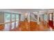 Spacious living room with hardwood floors, staircase, and views to the exterior deck at 1477 Triple Creek Nw Ct, Kennesaw, GA 30144