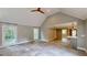 Bright living room with vaulted ceilings and access to the kitchen at 1477 Triple Creek Nw Ct, Kennesaw, GA 30144