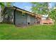 A charming backyard features a well-maintained lawn and a wood deck at 3372 Ward Drive Southwest Sw Dr, Atlanta, GA 30354