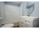 A stylish bathroom features tiled walls, vanity with drawers and a toilet at 3372 Ward Drive Southwest Sw Dr, Atlanta, GA 30354