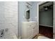 A stylish bathroom features tiled walls, vanity with drawers and new fixtures at 3372 Ward Drive Southwest Sw Dr, Atlanta, GA 30354