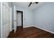 A cozy bedroom features hardwood floors, fan and a double door closet at 3372 Ward Drive Southwest Sw Dr, Atlanta, GA 30354