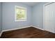 Comfortable bedroom featuring hardwood floors, a window and a closet at 3372 Ward Drive Southwest Sw Dr, Atlanta, GA 30354