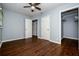 A spacious bedroom features hardwood floors, ceiling fan, and two closets at 3372 Ward Drive Southwest Sw Dr, Atlanta, GA 30354