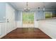 Bright dining area with hardwood floors and sliding glass doors leading to outdoor deck at 3372 Ward Drive Southwest Sw Dr, Atlanta, GA 30354
