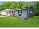Lovely view of the home's side exterior, with a well-maintained lawn and landscaping at 3372 Ward Drive Southwest Sw Dr, Atlanta, GA 30354