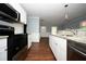 Modern kitchen features stainless steel appliances, white cabinets, and granite countertops at 3372 Ward Drive Southwest Sw Dr, Atlanta, GA 30354