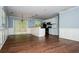 Open living space with hardwood floors and a seamless transition to the kitchen area at 3372 Ward Drive Southwest Sw Dr, Atlanta, GA 30354