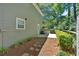 Landscaped backyard featuring stone walkway and fence-lined yard at 3544 Chestatee Dr, Marietta, GA 30062