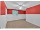 Red bedroom with white trim, plush carpet, a ceiling fan, and window with natural light at 3544 Chestatee Dr, Marietta, GA 30062