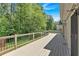 Wide deck with a view of trees, green grass, and a bit of sky at 3544 Chestatee Dr, Marietta, GA 30062