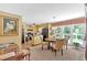 This dining room features a chandelier, table for four, and sliding glass doors for ample natural light at 3544 Chestatee Dr, Marietta, GA 30062