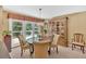 Classic dining room with a chandelier, a table for four, and sliding glass doors to the outdoor space at 3544 Chestatee Dr, Marietta, GA 30062