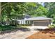 Charming gray two-story home with well-manicured lawn and two car garage at 3544 Chestatee Dr, Marietta, GA 30062