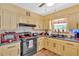 Well-lit kitchen featuring painted cabinets, modern appliances, and a window view at 3544 Chestatee Dr, Marietta, GA 30062