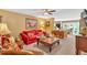 Open-concept living room with plenty of furniture offers a smooth transition to the kitchen and dining room at 3544 Chestatee Dr, Marietta, GA 30062