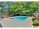 Backyard oasis featuring a sparkling pool and lush greenery at 3544 Chestatee Dr, Marietta, GA 30062