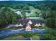 An aerial view shows the clubhouse near the golf course and surrounded by green space at 3642 Fowler Rdg, Douglasville, GA 30135