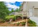 Well-maintained backyard with a deck, patio, and stepping stones at 3642 Fowler Rdg, Douglasville, GA 30135