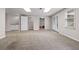 Carpeted basement with a wet bar and access to a bathroom and backyard at 3642 Fowler Rdg, Douglasville, GA 30135