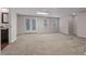 Finished basement featuring recessed lighting, double doors leading to the backyard, and carpeted flooring at 3642 Fowler Rdg, Douglasville, GA 30135
