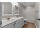 Bathroom with double sink vanity, tub-shower combo, and neutral color scheme at 3642 Fowler Rdg, Douglasville, GA 30135
