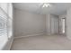 Bright bedroom with carpet, neutral paint and large window that provides ample natural light at 3642 Fowler Rdg, Douglasville, GA 30135