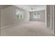 Spacious bedroom featuring neutral walls, carpet, and natural light from the windows at 3642 Fowler Rdg, Douglasville, GA 30135