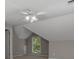 Attic bedroom with a ceiling fan, sloped ceiling and window at 3642 Fowler Rdg, Douglasville, GA 30135
