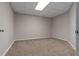 A carpeted bedroom with neutral walls and a drop ceiling at 3642 Fowler Rdg, Douglasville, GA 30135