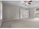 Large bedroom with tray ceiling and carpet floors at 3642 Fowler Rdg, Douglasville, GA 30135