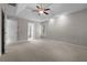 Spacious bedroom featuring a tray ceiling, and a fan light fixture at 3642 Fowler Rdg, Douglasville, GA 30135