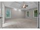 Spacious bedroom with tray ceiling and carpet floors at 3642 Fowler Rdg, Douglasville, GA 30135