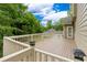 Spacious wooden deck with white railings and built-in lighting at 3642 Fowler Rdg, Douglasville, GA 30135
