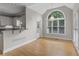 Bright dining area with hardwood floors and a large arched window that provides natural light at 3642 Fowler Rdg, Douglasville, GA 30135
