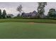 The home boasts a beautiful backyard, complete with a putting green and an elegant covered porch at 3642 Fowler Rdg, Douglasville, GA 30135