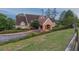 Exterior shot of a community center building featuring a well-manicured lawn and colorful flower beds at 3642 Fowler Rdg, Douglasville, GA 30135