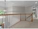 Upper foyer featuring hardwood banister and neutral carpet at 3642 Fowler Rdg, Douglasville, GA 30135