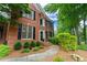 Inviting red brick home with a curved walkway and well-maintained landscaping at 3642 Fowler Rdg, Douglasville, GA 30135