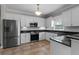 This is a beautiful kitchen with stainless steel appliances and white cabinets, plus granite countertops and subway tile backsplash at 3642 Fowler Rdg, Douglasville, GA 30135