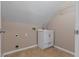 Functional laundry area featuring a utility sink with cabinet storage and tile floors at 3642 Fowler Rdg, Douglasville, GA 30135