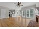 Spacious living room boasts hardwood floors, a fireplace, and abundant natural light from large windows. Adjacent to the kitchen at 3642 Fowler Rdg, Douglasville, GA 30135