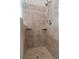 Tiled shower with built-in shelves and a shower head at 3642 Fowler Rdg, Douglasville, GA 30135