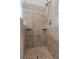 Tile shower featuring two shelves and mosaic tile floor at 3642 Fowler Rdg, Douglasville, GA 30135
