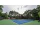 A view of tennis courts, surrounded by trees at 3642 Fowler Rdg, Douglasville, GA 30135