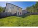 A spacious backyard with a wood fence, providing privacy and room for outdoor activities at 4238 Sir Dixon Dr, Fairburn, GA 30213