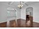 Dining room has hardwood floors, stylish lighting, and access to other rooms for easy entertaining at 4238 Sir Dixon Dr, Fairburn, GA 30213